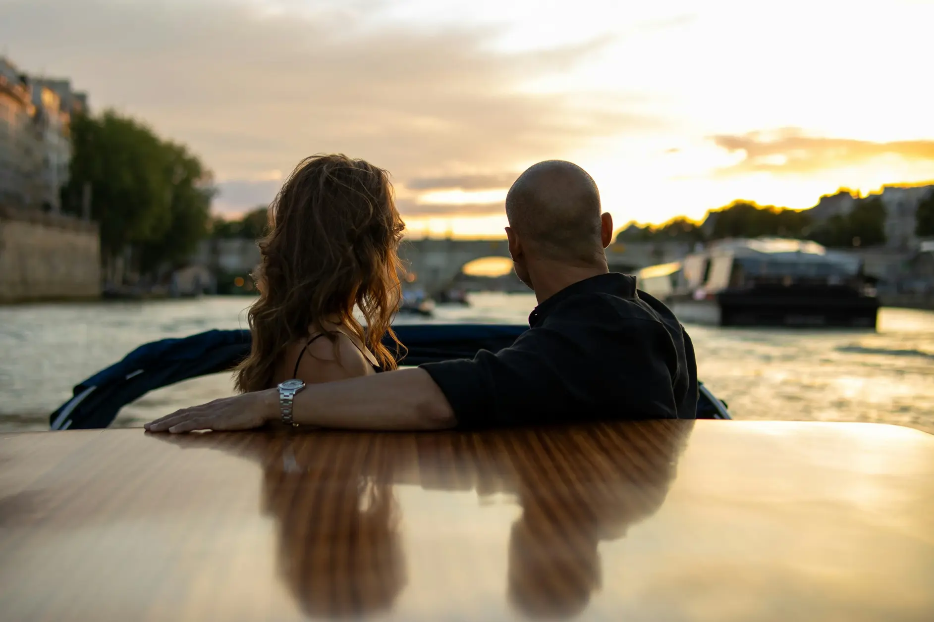 A couple on a sunset boat cruise on the Tagus in Lisbon